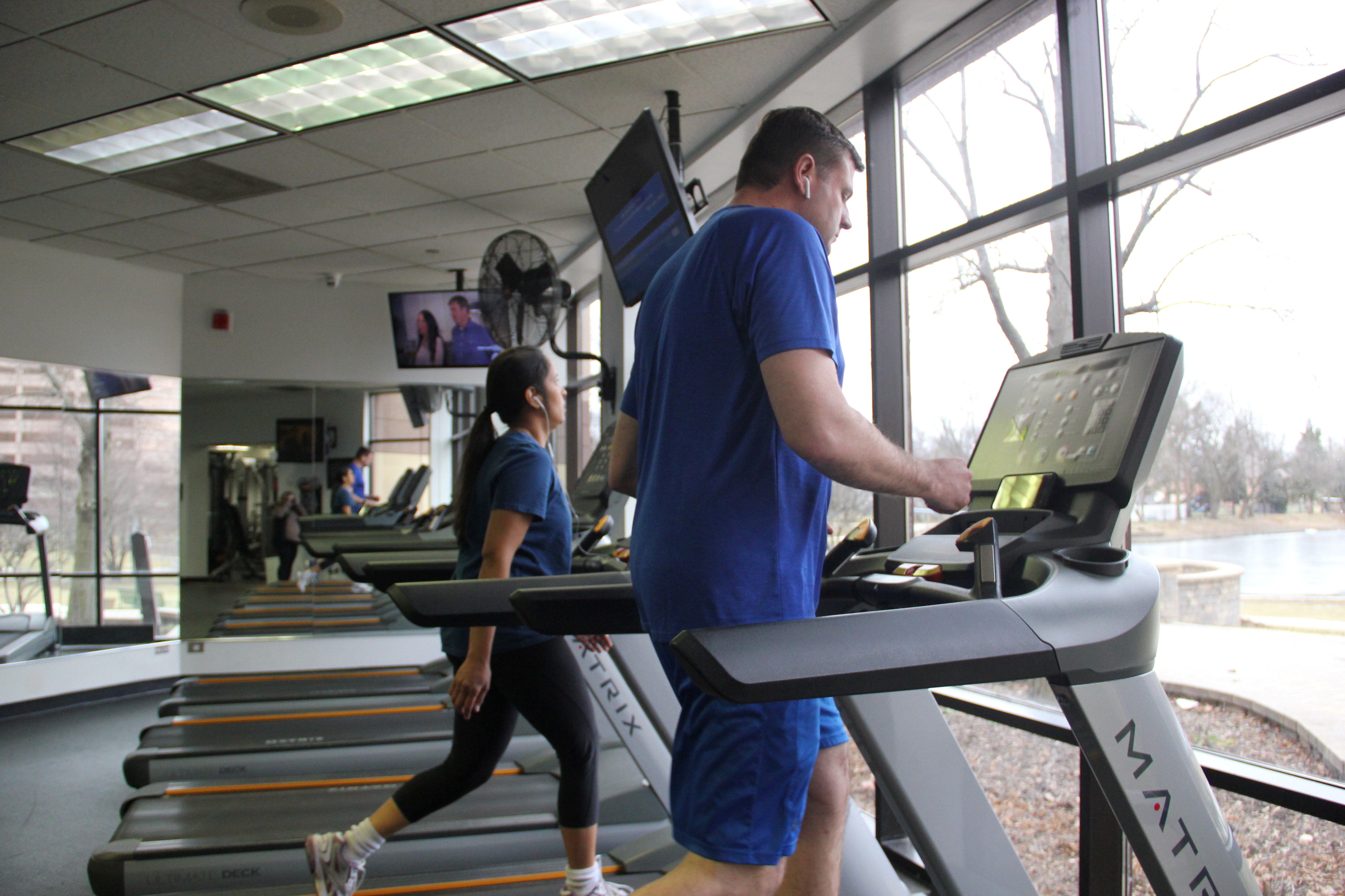 Two people on treadmill 