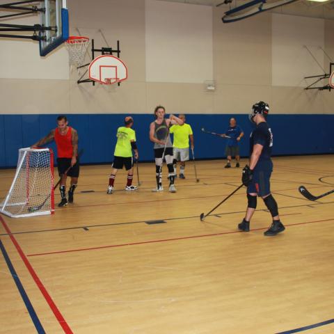 Men playing Roller Hockey 